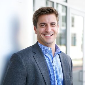 Plumber smiling after AI handled incoming customer calls