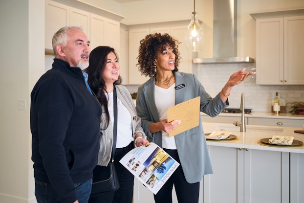 Real estate agent using AI voice assistant for client communication